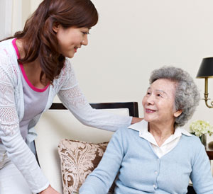 Young woman talking with elderly woman