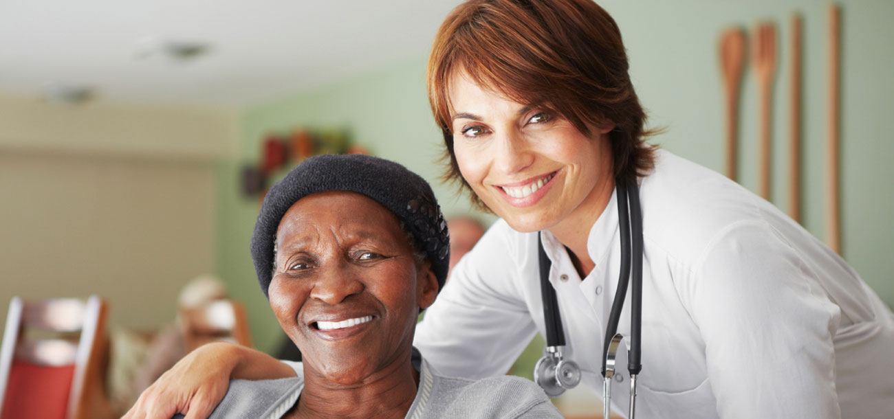 Nurse and elderly woman smiling
